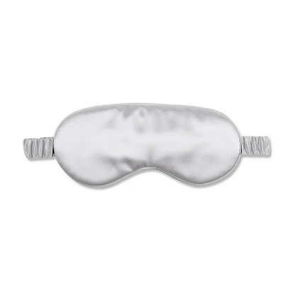 White Trousseau's 100% Mulberry Silk Eye Mask in Silver. Made of OEKO-TEX® certified, 22 momme organic silk, our sleep eye mask is specially made to cure dark eye circles, as well as puffy and swollen eyes. Wake up with brighter, healthier and anti-aging skin simply by wearing this to sleep! 