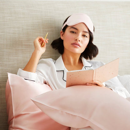 Model with 100% pure mulberry silk pillowcase and eye mask in pink