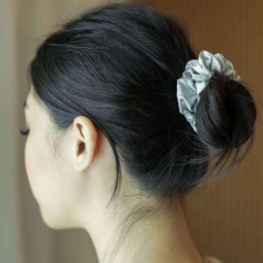 A hair scrunchie designed to avoid hair creases, hair tangles. Reduce frizzy hair and hair breakages.